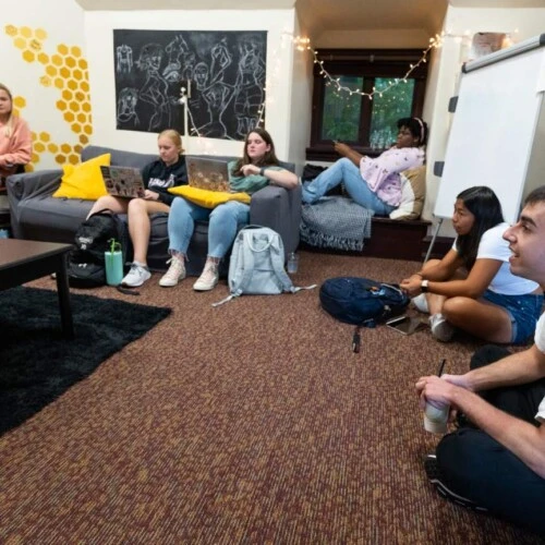 Students sit in an honors class in The Hive.