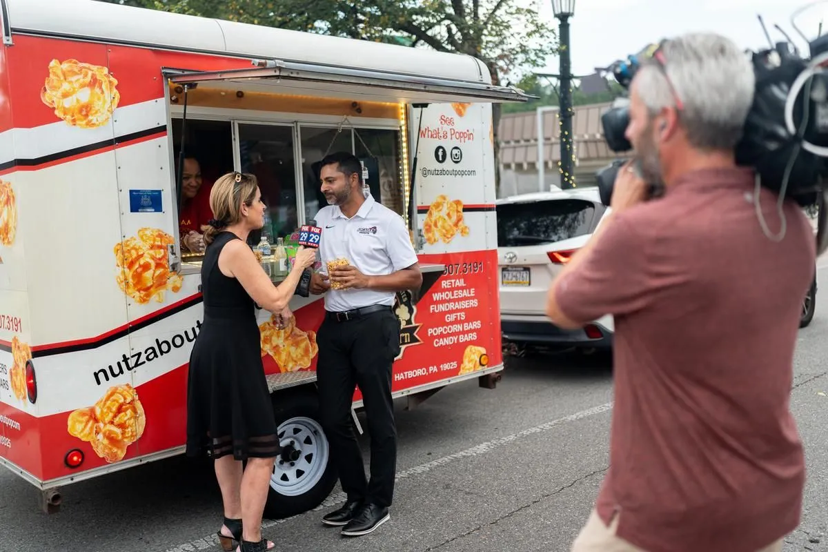 Kathy Orr interviews president Ajay Nair at the Downtown Glenside Food Truck Festival