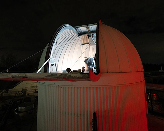 The roof top Observatory at Boyer Hall of Science with its door open to the galaxies.
