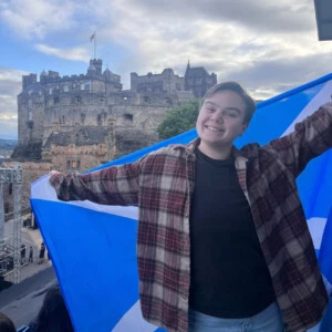 Meyers holding the Scottish flag in Scotland.