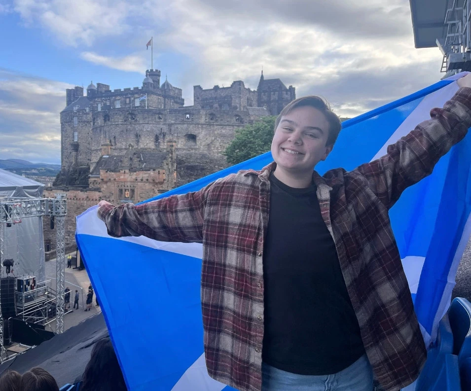 Meyers holding the Scottish flag in Scotland.