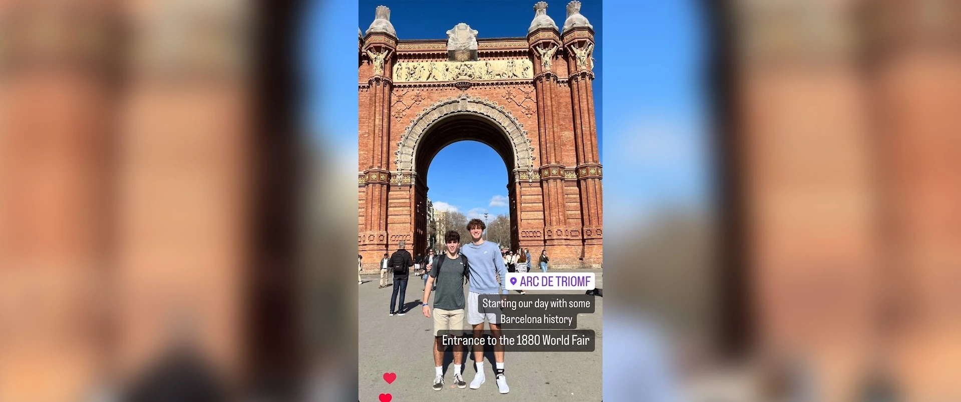 Two Arcadia students stand by a brick Spanish structure in Barcelona.