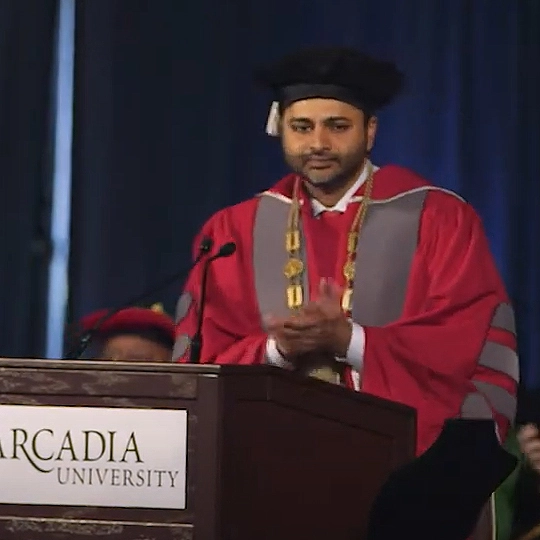 Presient Ajay Nair speaks at a podeum during his 2018 Inauguration.