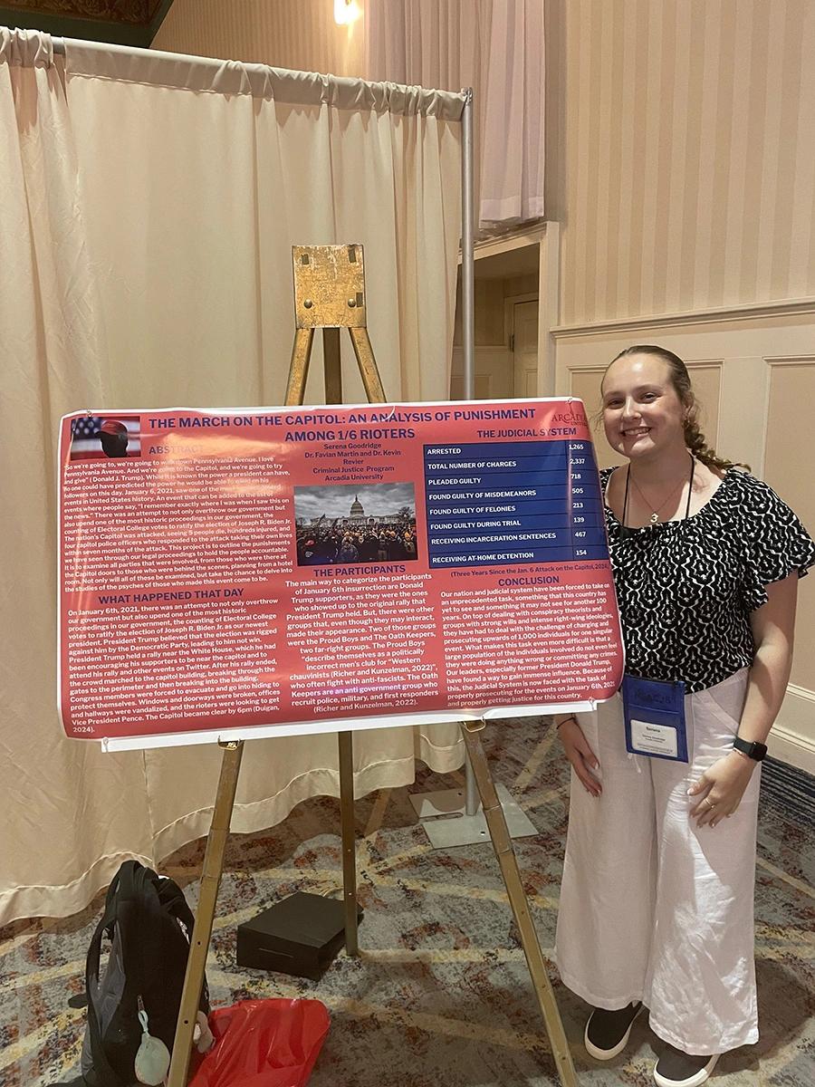 A Criminal Justice major with their poster at the NEACJS conference.