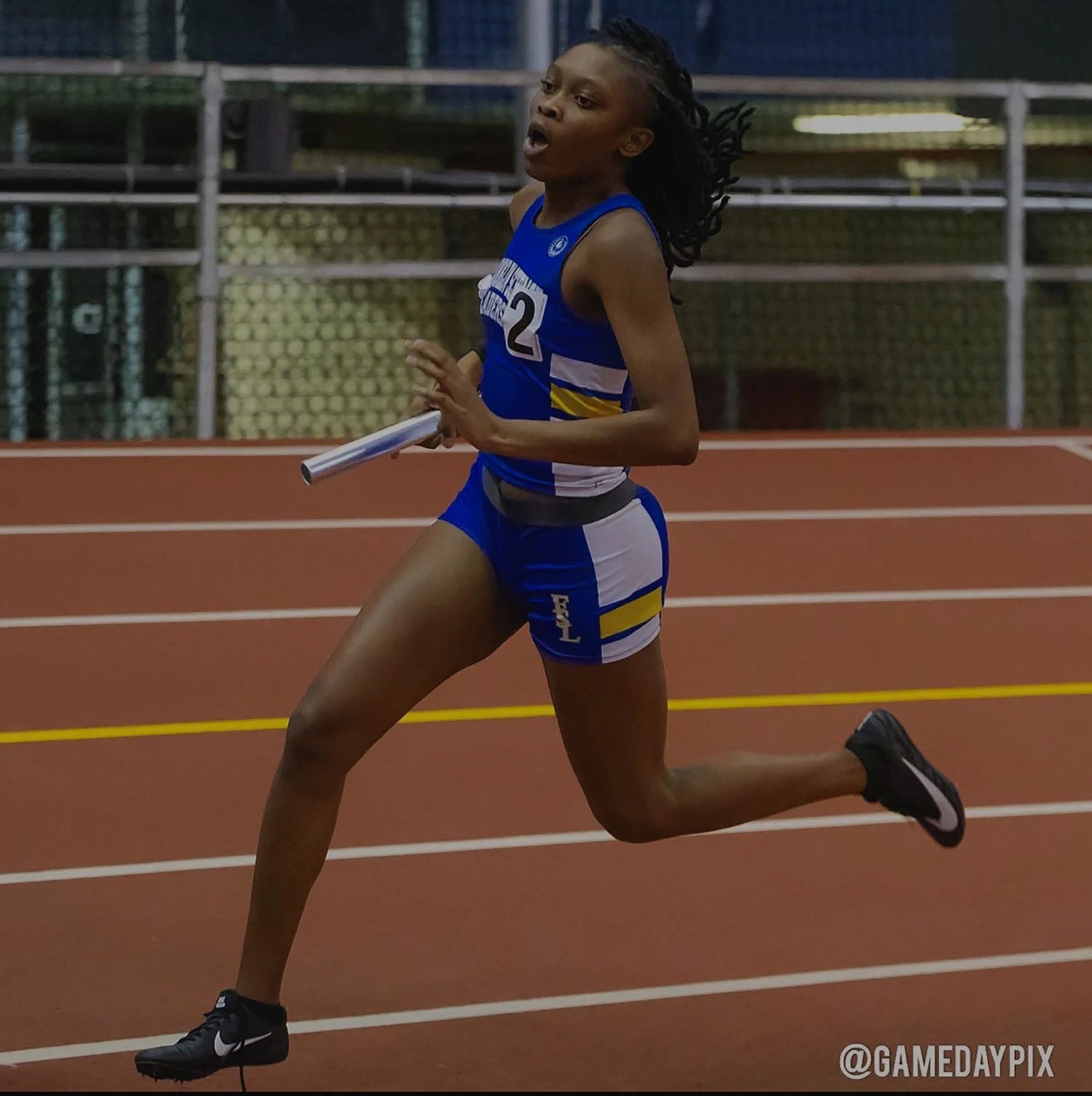 Destiny Barnett running on the track.