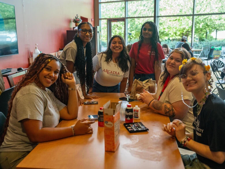 Orientation leader and new students in Easton Cafe