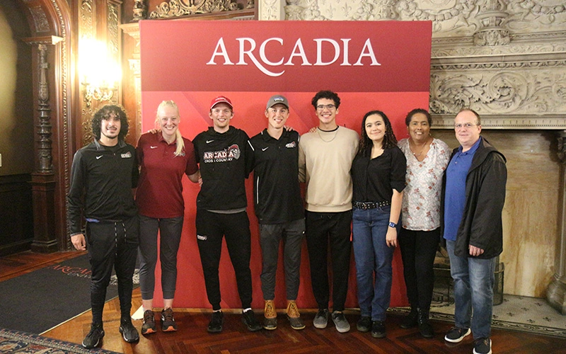 A group of people posing during Arcadia Homecoming.