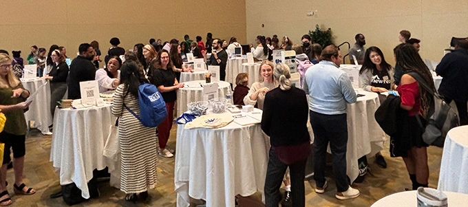 Students speak with employers at the 2024 Professional Pathways Reception.