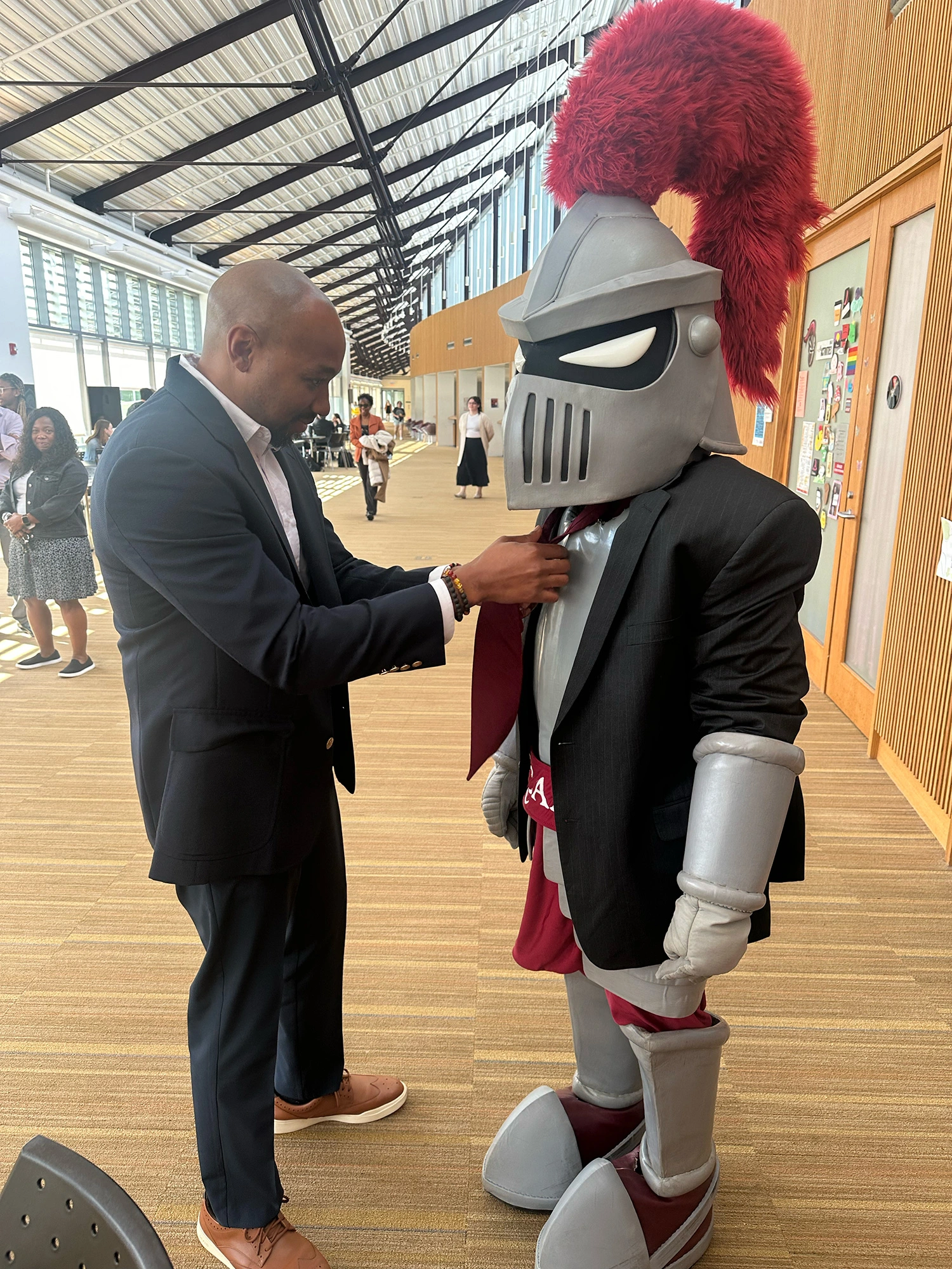 Dr. McCargo tying Archie's Tie.