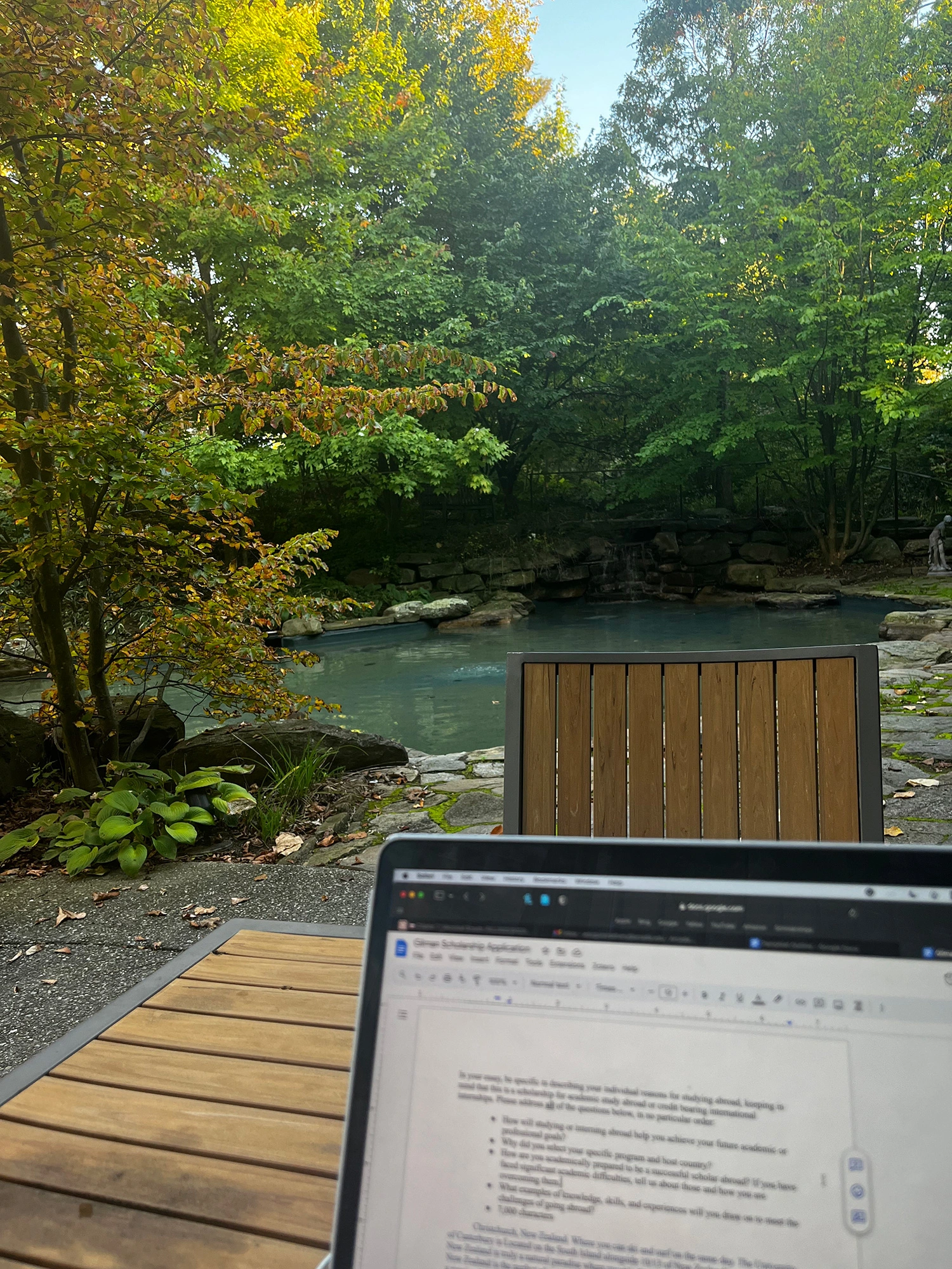 A computer on a table by Easton Pond.