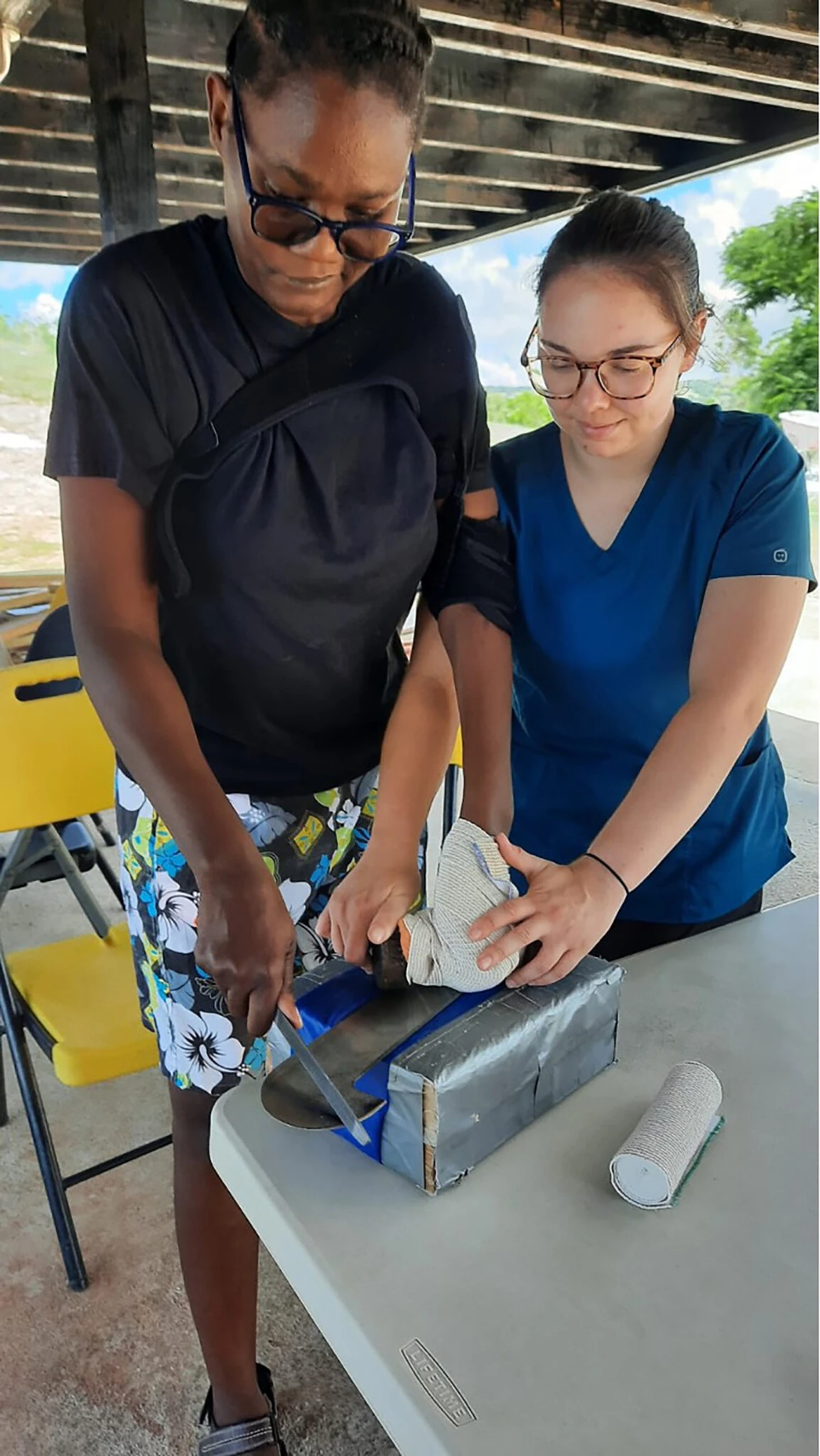 A DPT student and patient in Jamaica.