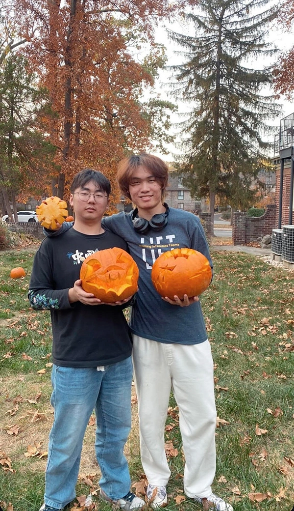 Eddie Lu and Allen Shi show off their finished masterpieces