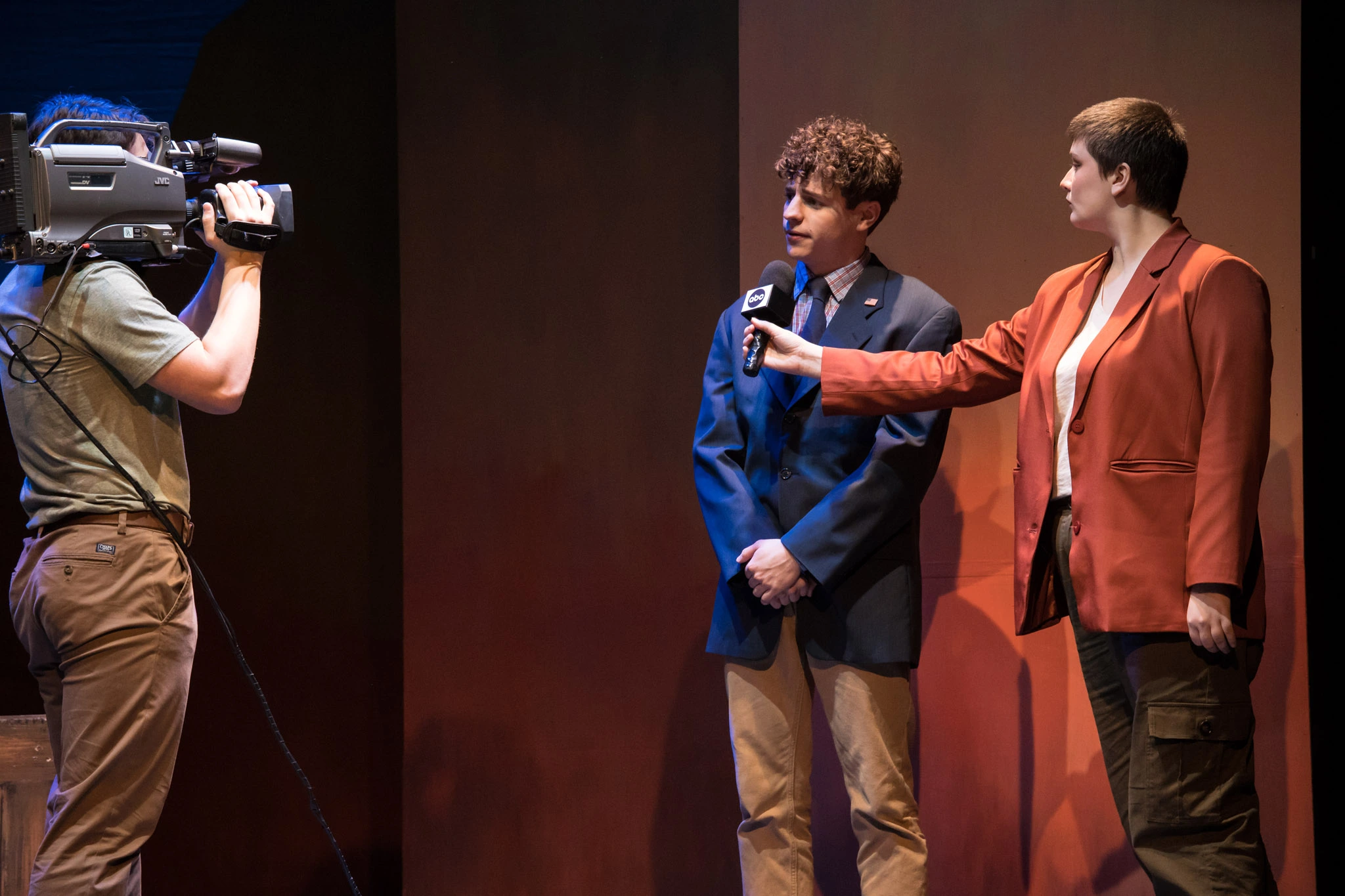 Three actors on stage for The Laramie Project play.