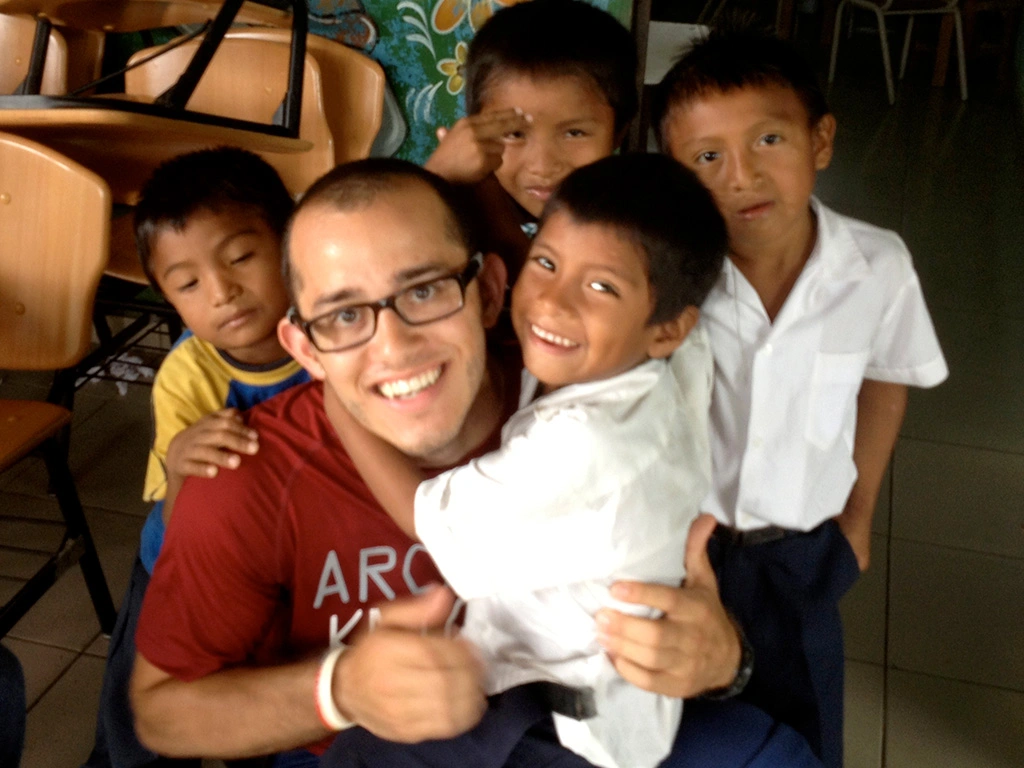 Joel Burgos works with children overseas in the global Bridges program.