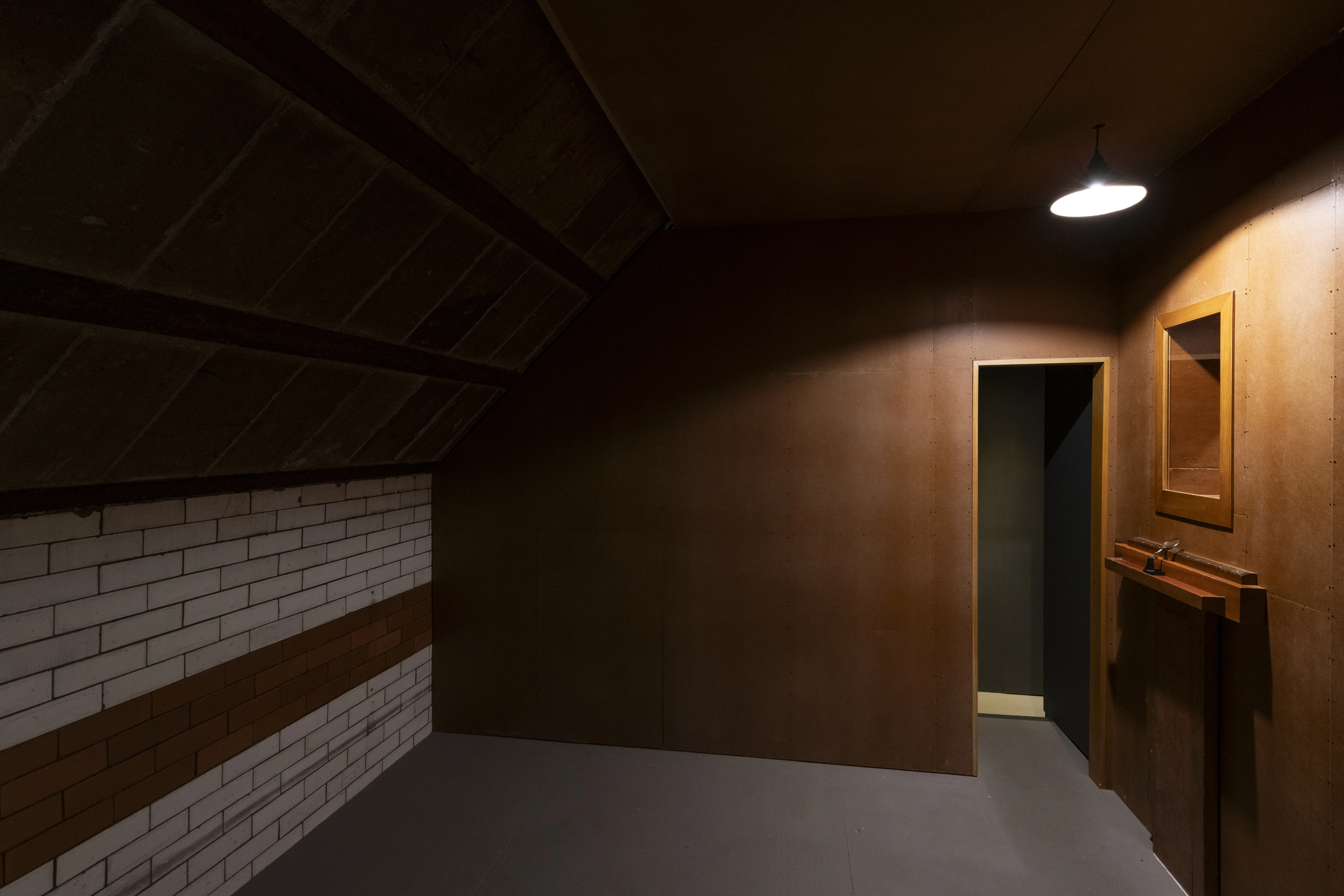 Dimly lit wooden room, part of 