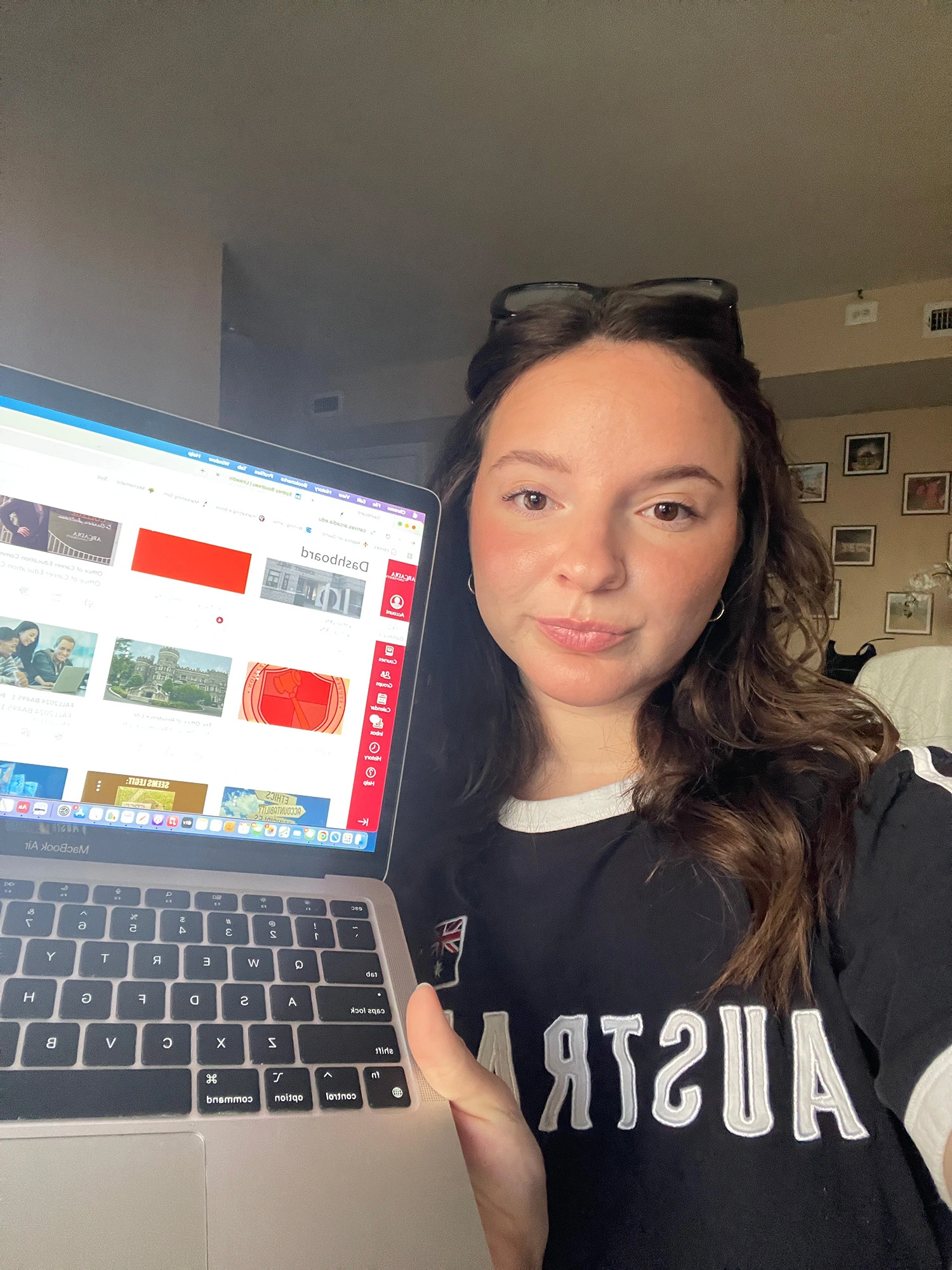 Sydney Boudreau ’25 showing the Canvas homepage on her laptop.