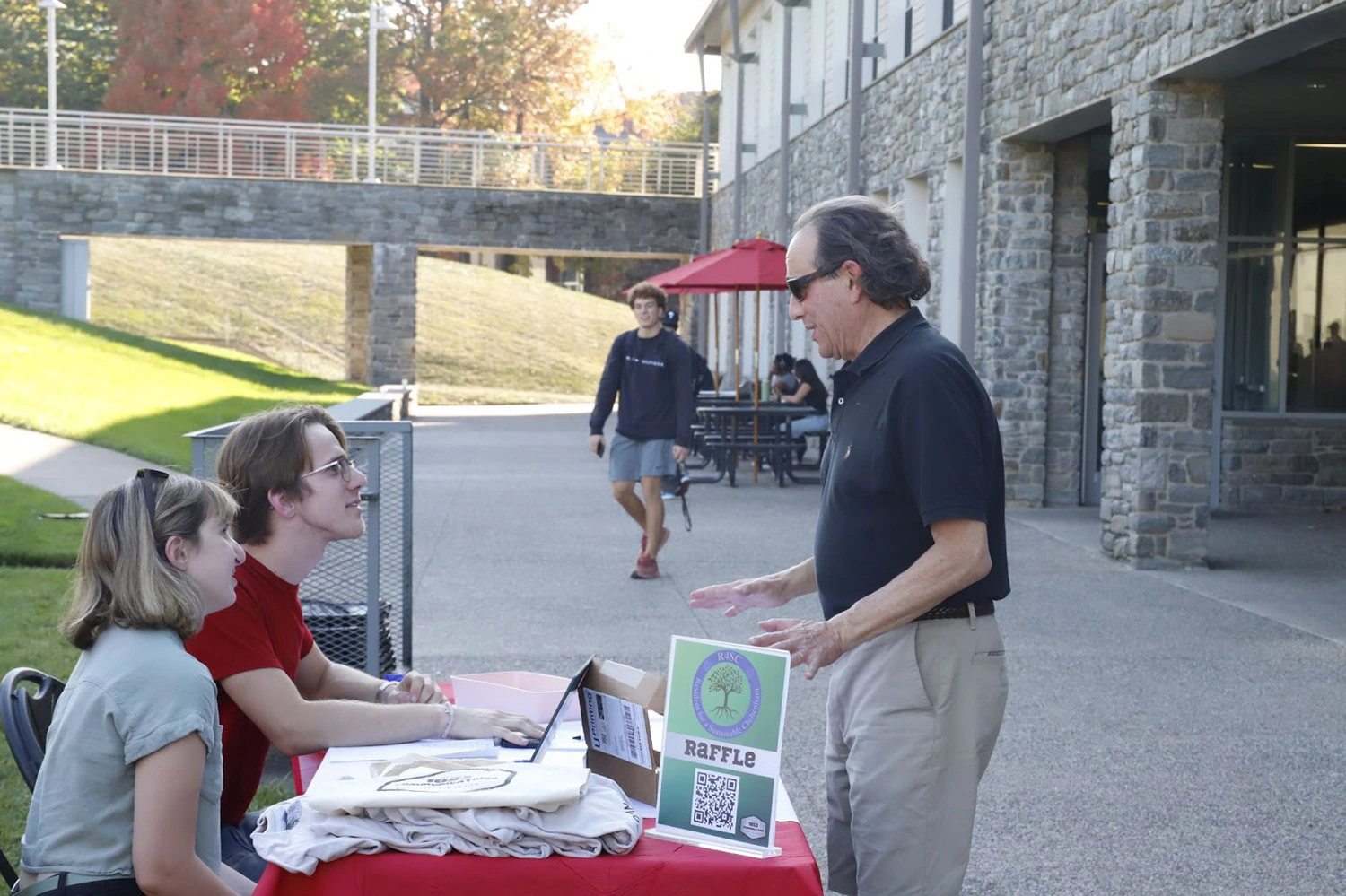 1853 Communications students interacting with community members.