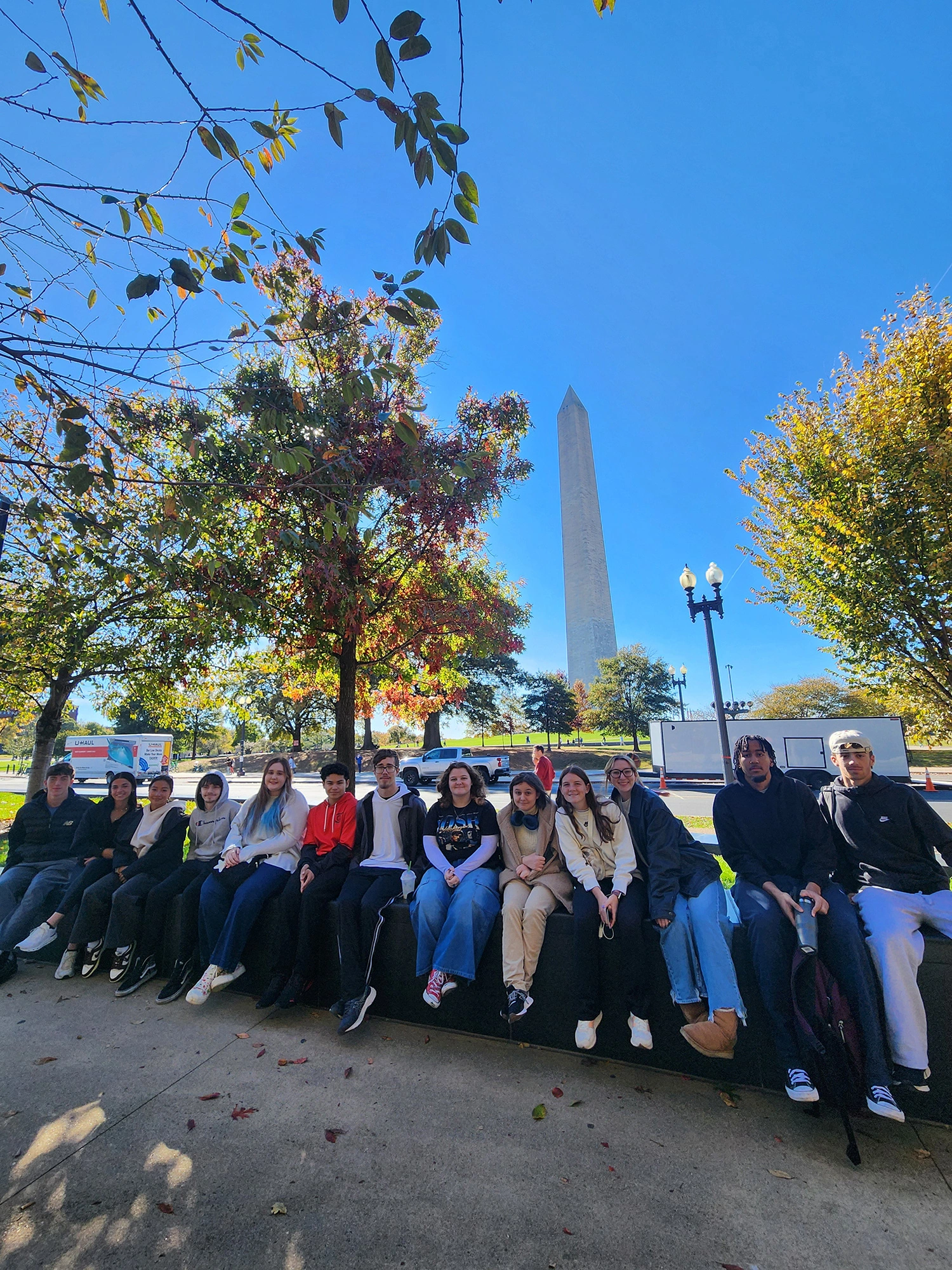 Prof. McCreery's FYS class sitting in front of the Washington Monument.