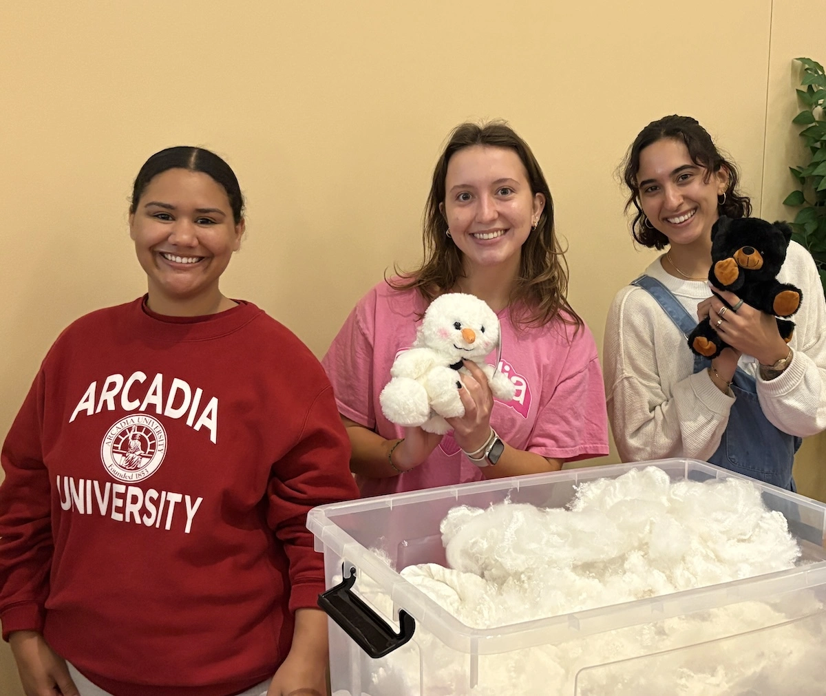 students hold stuffed animals