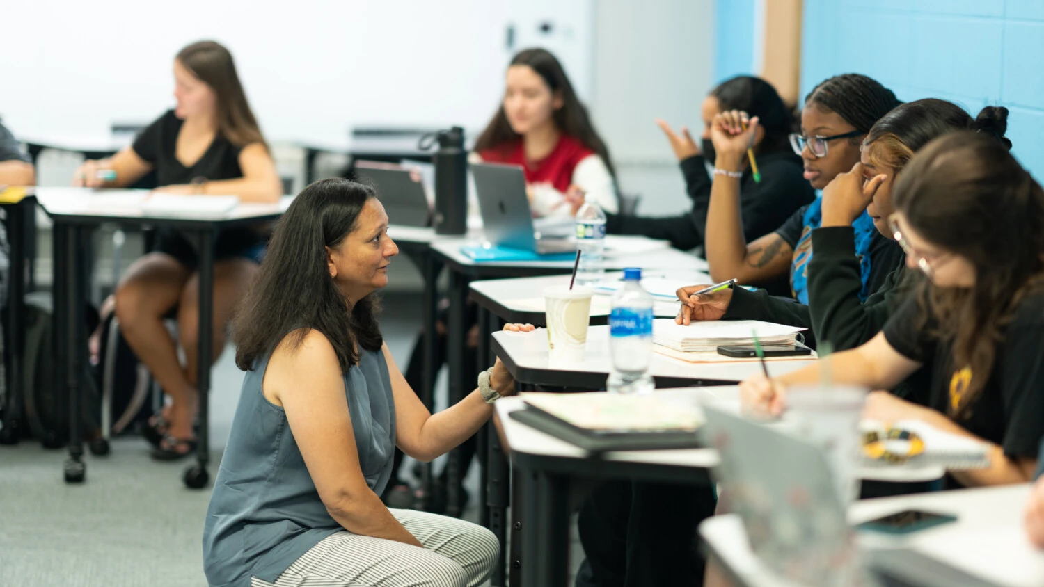 A professor listening to her students