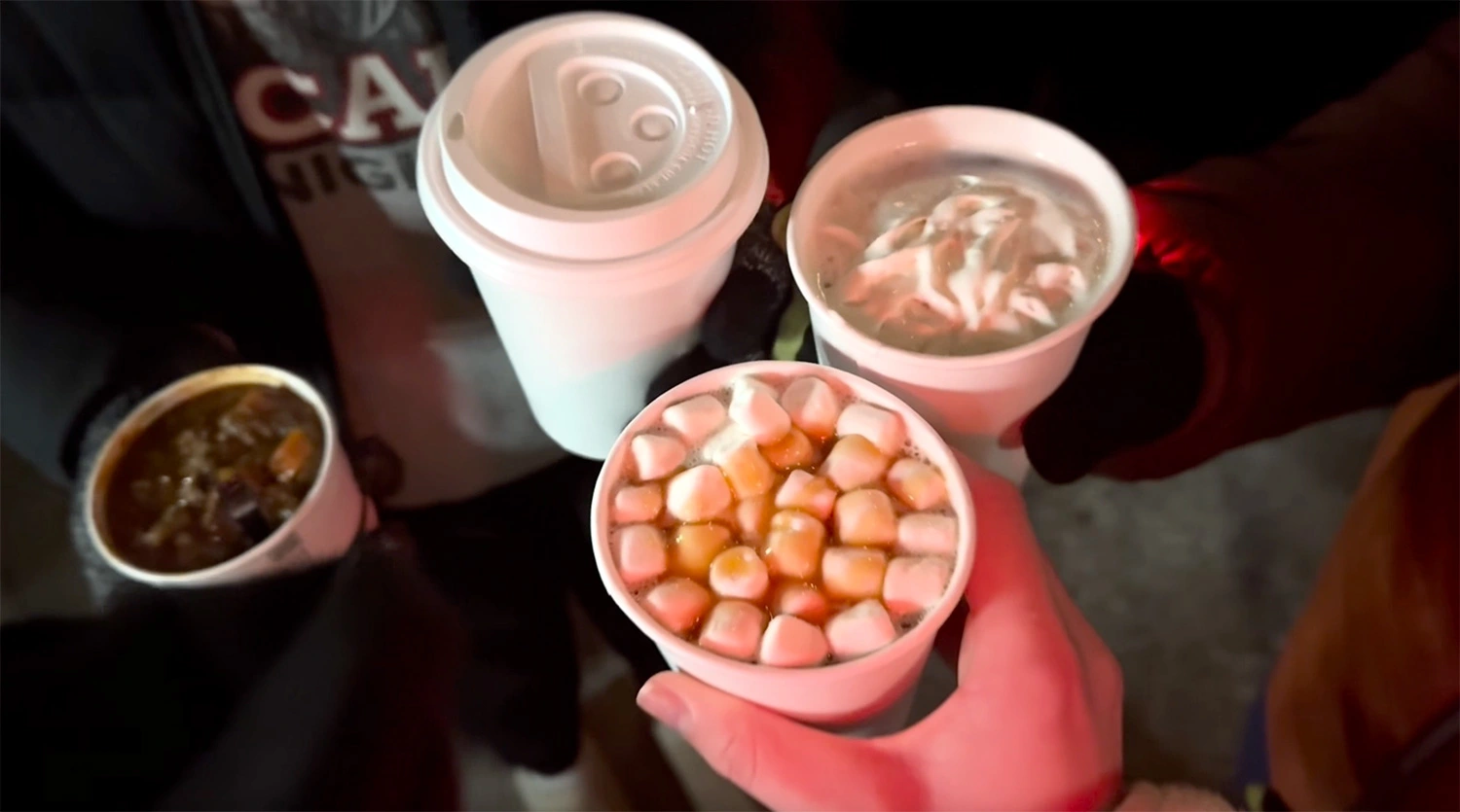 Devon Young ’28 sharing hot cocoa with her friends.