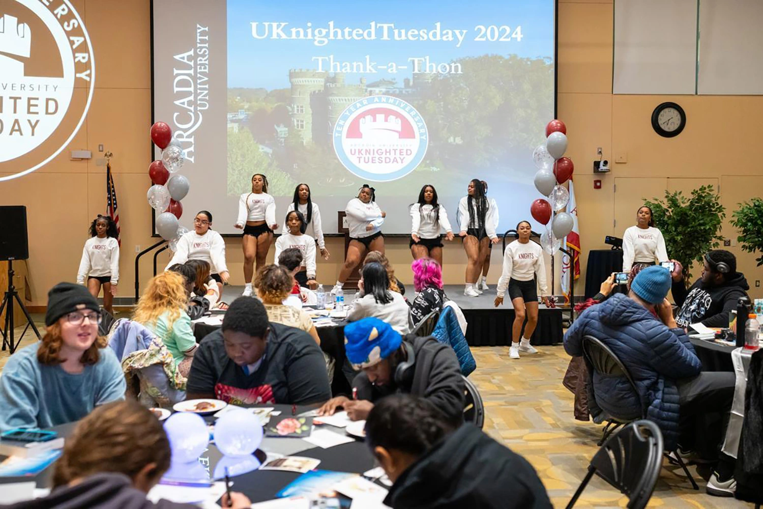 Students dancing on stage at the UKT Thank-a-Thon.