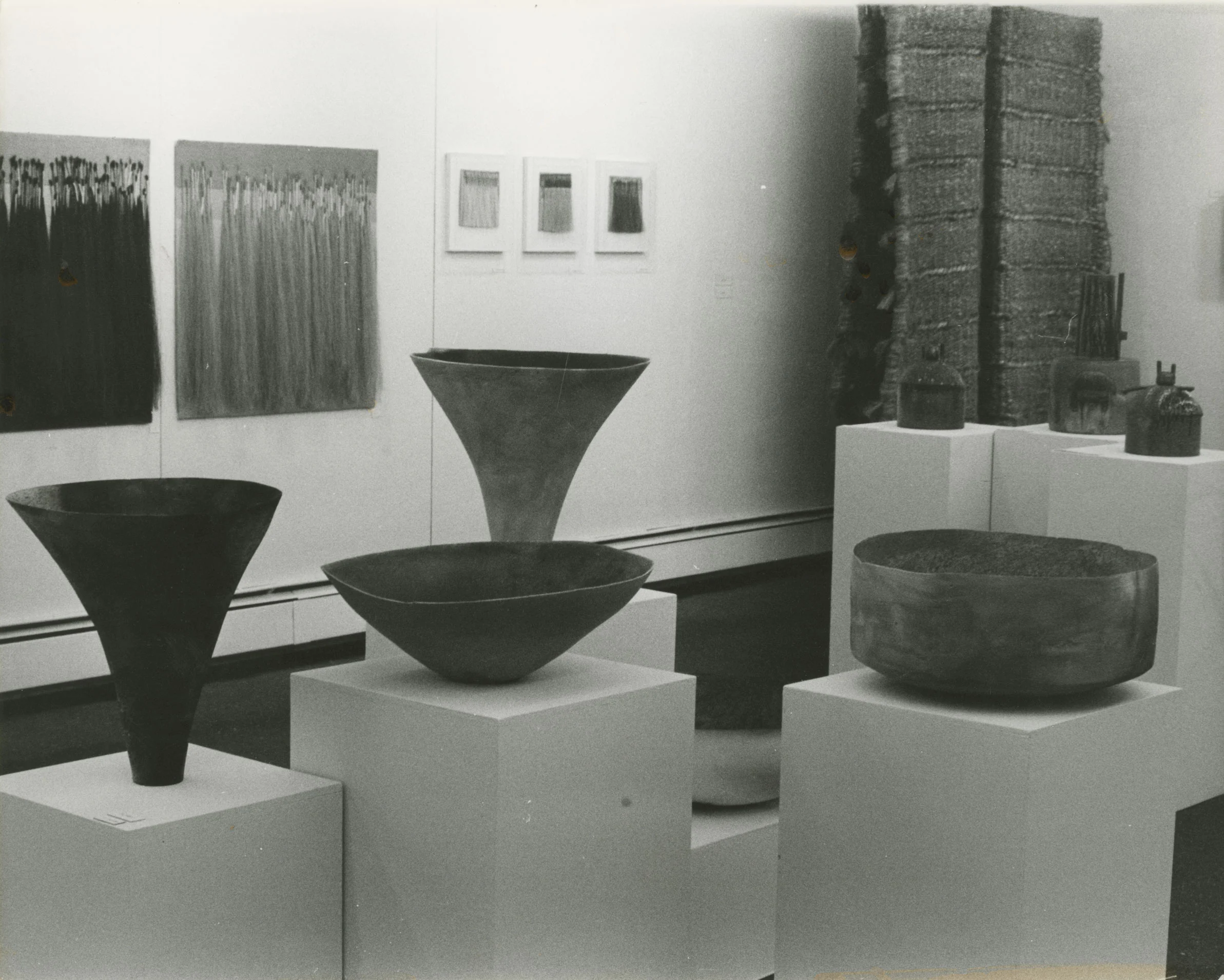 Installation view of ceramics, metals, and weaving.