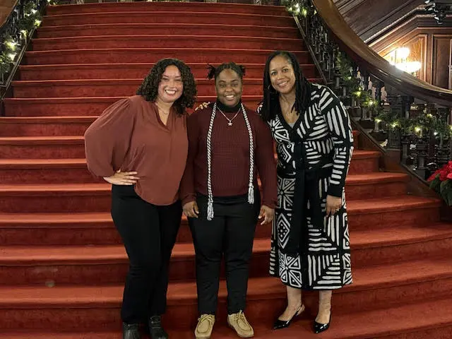 Professors and a student posing for a picture at the Psi Chi 2024.