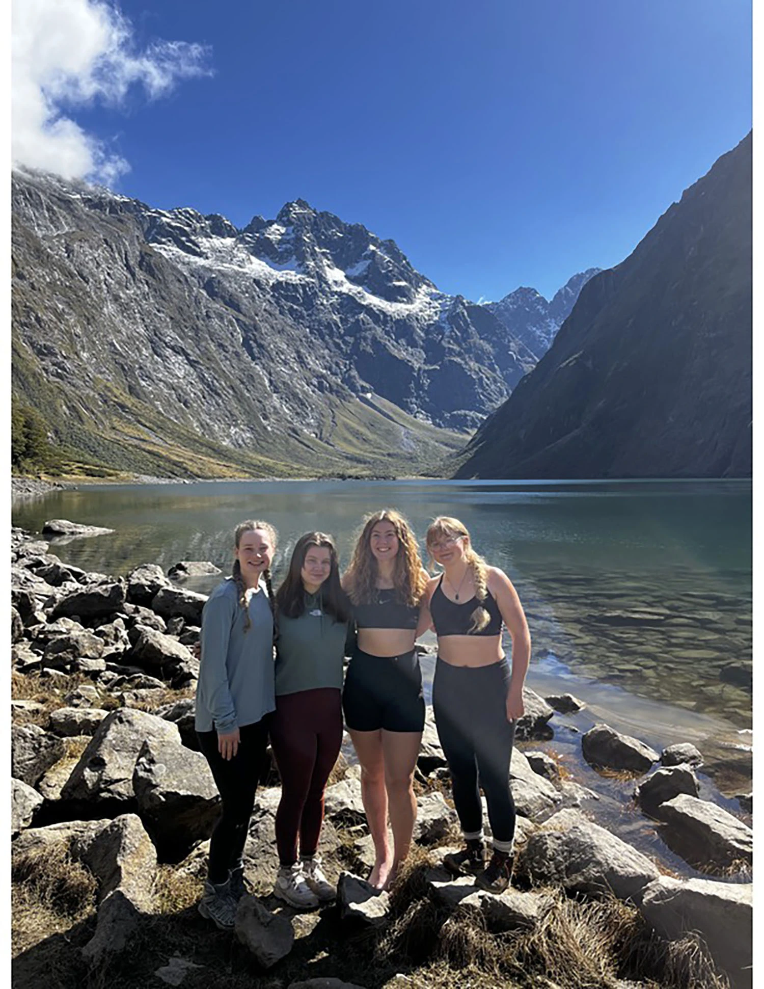 Amellia McGuire-Matheny ’25 and friends by a lake.