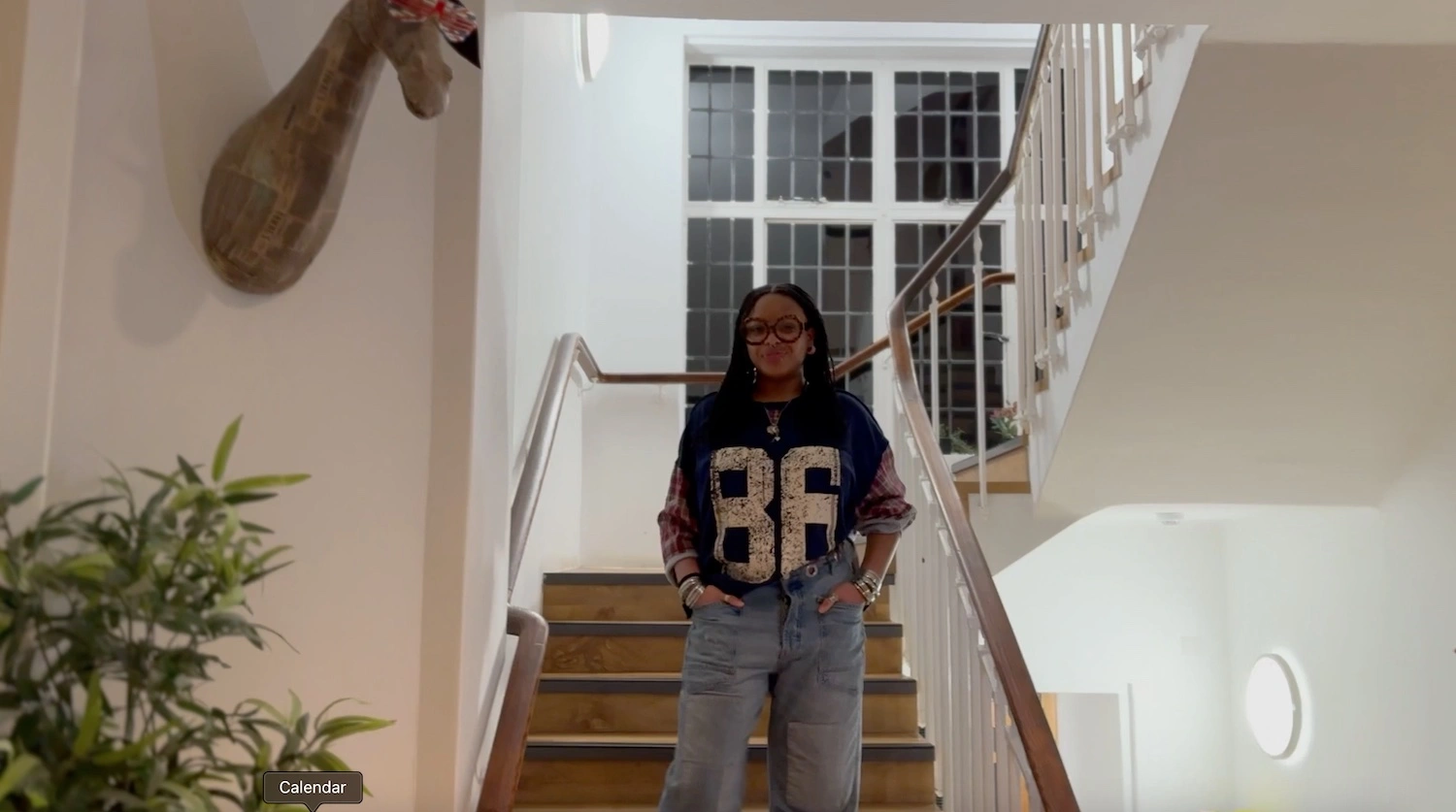 Jamai Vann ’28 standing on the stairs of the Elizabeth House.