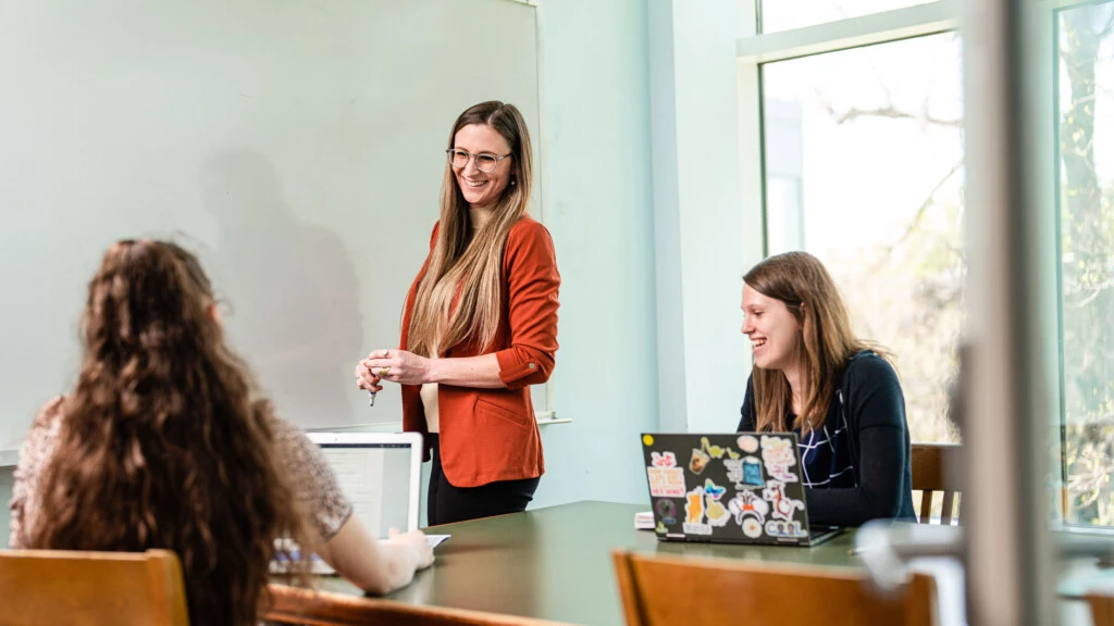 A professor interacting with students